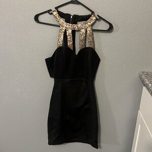 Black and gold sequence dress